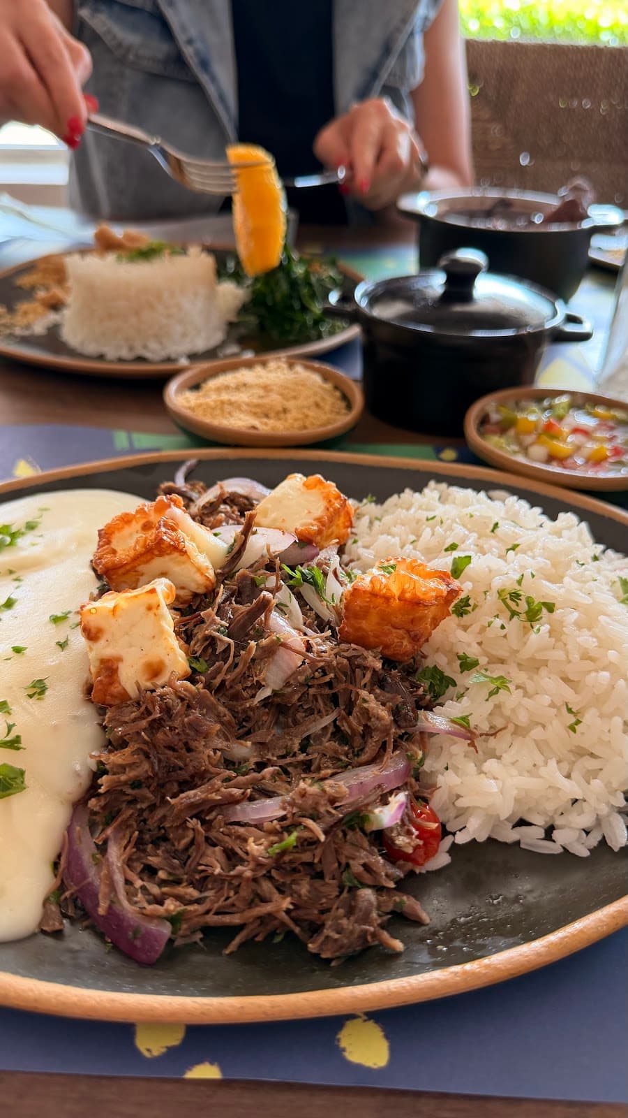 Brazilian plate with rice, meat, and sides at RememBR Weston